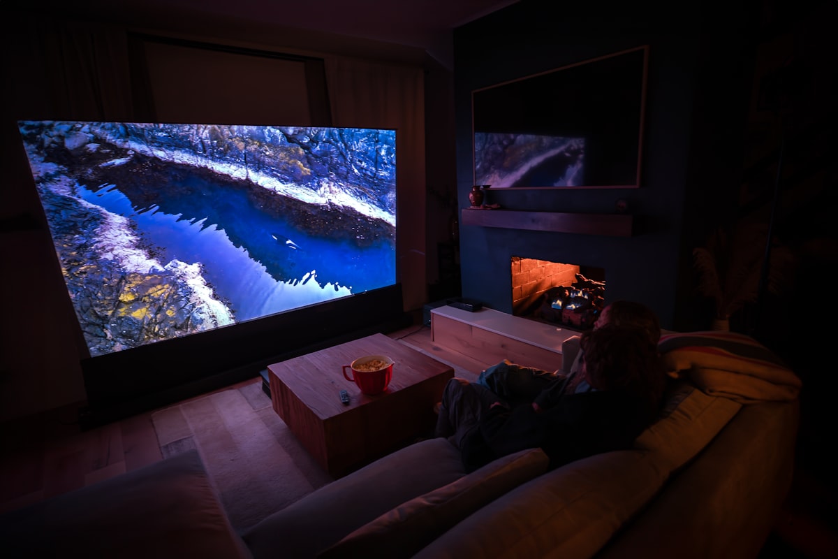 Dark home theatre with cinematic projection screen